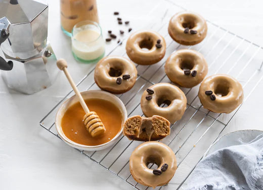 donuts on baking tray with honey