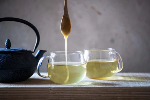 honey dripping into tea