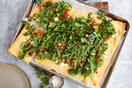 Flat bread with rocket on top